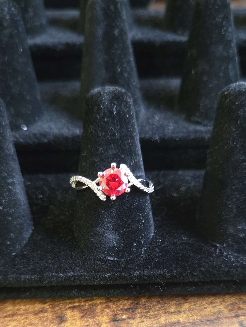 Twisted Sterling Silver Ring with Vibrant Red Moissanite